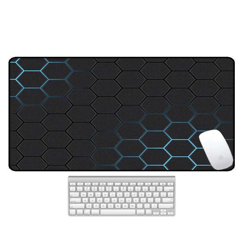 Large rectangular desk mat with printed pattern on a wooden desk, featuring a keyboard and mouse.