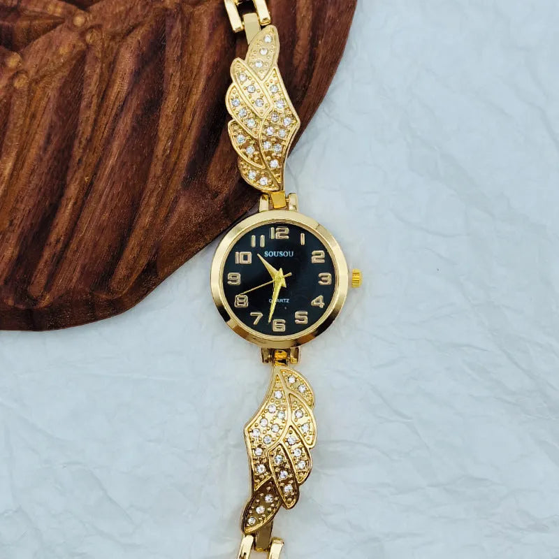 Women's stainless steel watch with round dial showing gold surface, 9mm thickness, and vachette clasp buckle