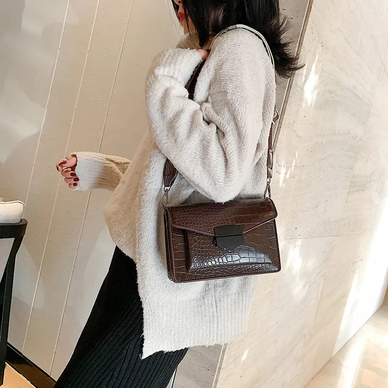 Vintage PU crossbody bag in black, dark brown, khaki, or red with dimensions 20cm wide by 14cm high.