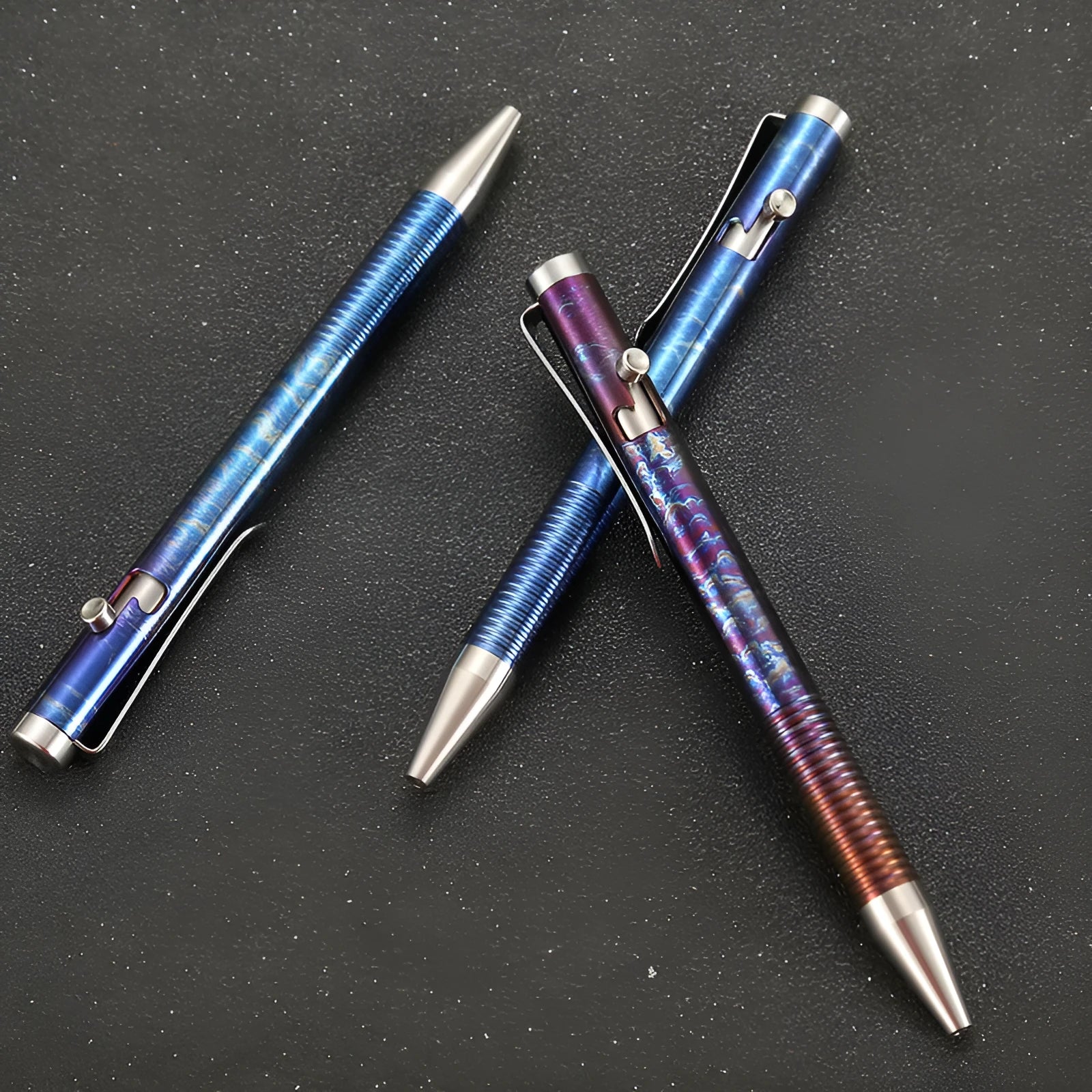 Titanium alloy magic colour pen with gun bolt handle design on a dark background.