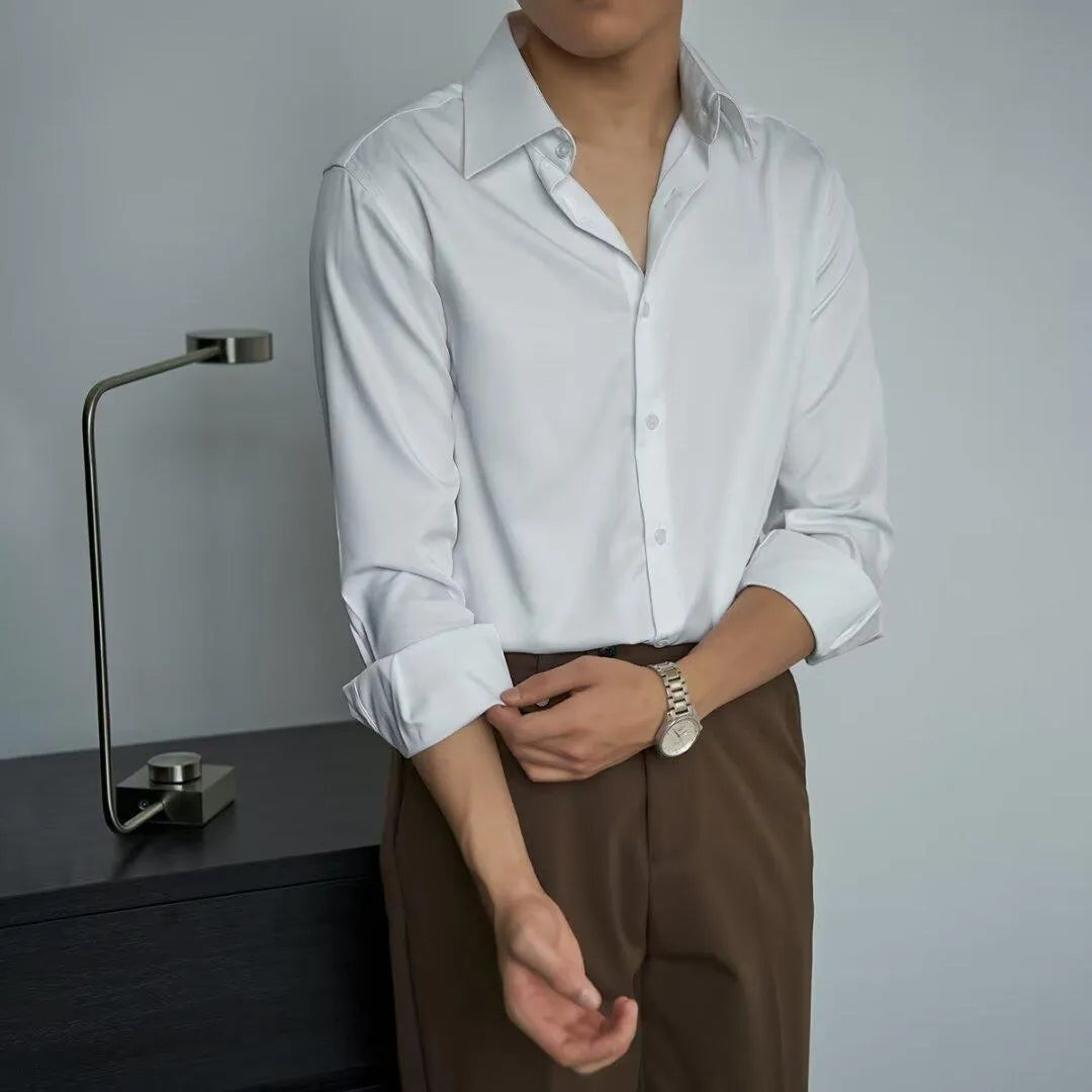 Man wearing a black loose-fit Korean style long sleeve cardigan shirt with Japanese retro design details.