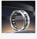 Diamond inlaid smart ring for blood oxygen monitoring in silver and gold colours on a finger.