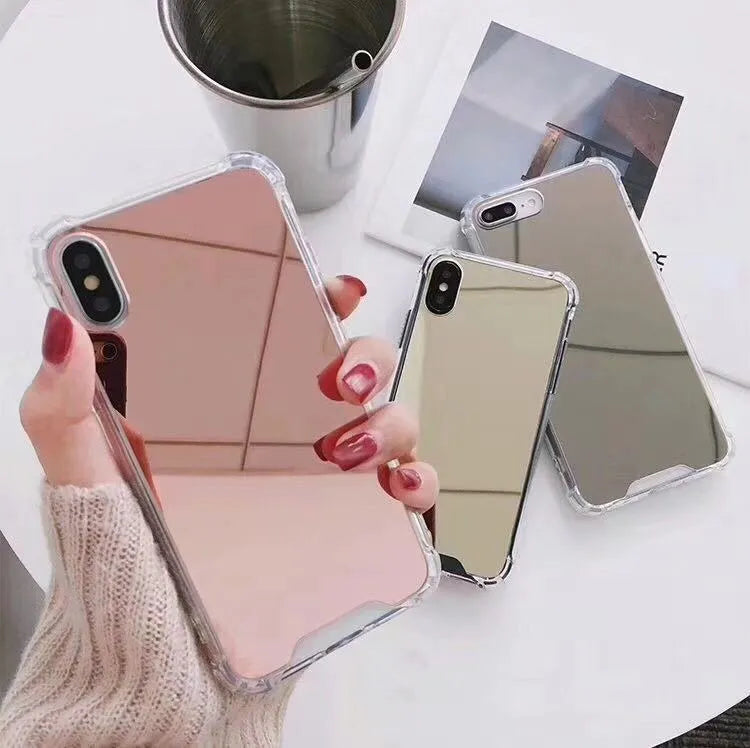 Mirror phone case for iPhone showing reflective back surface and soft TPU edges in multiple colour options.