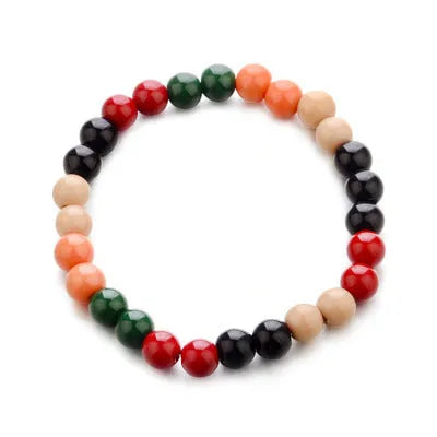 Natural stone beaded bracelet with lava stones on a wrist, showing ethnic style and unisex design.