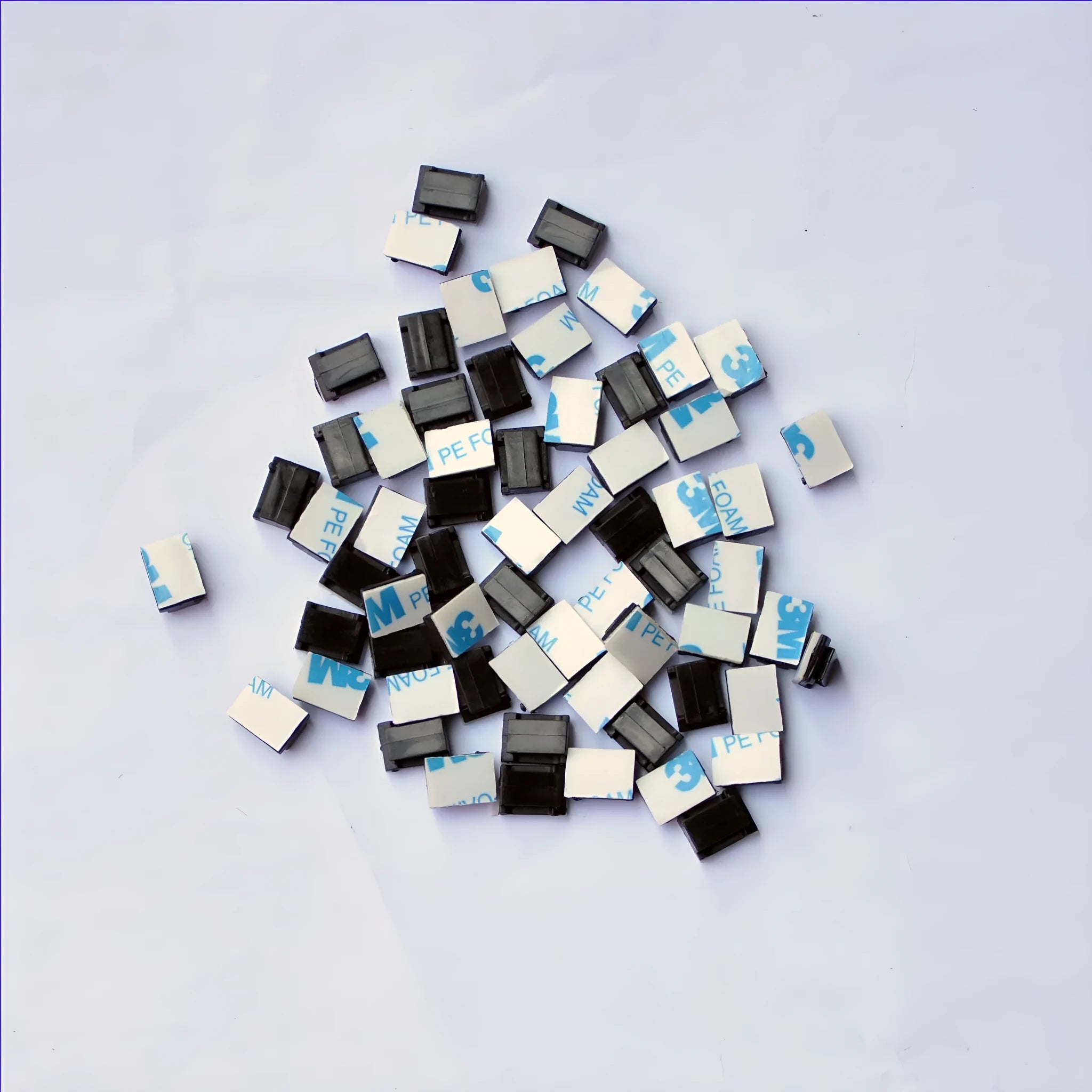 Black PA66 plastic automotive cable retaining clips for wiring management measuring 9mm by 12mm by 6.2mm