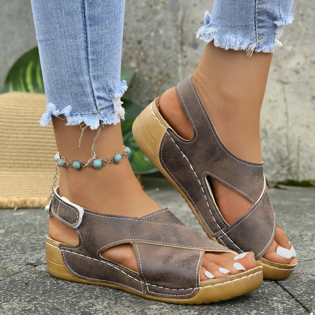 Roman platform sandals with skirt detail showing adjustable Velcro strap and open toe design