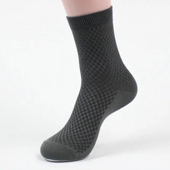Men's black bamboo fibre socks with small square pattern on ankle