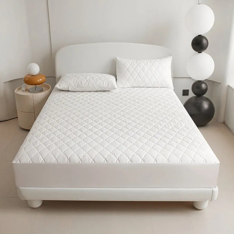 Diamond lattice quilted waterproof mattress protector set with fitted sheet and pillowcases in solid colour.