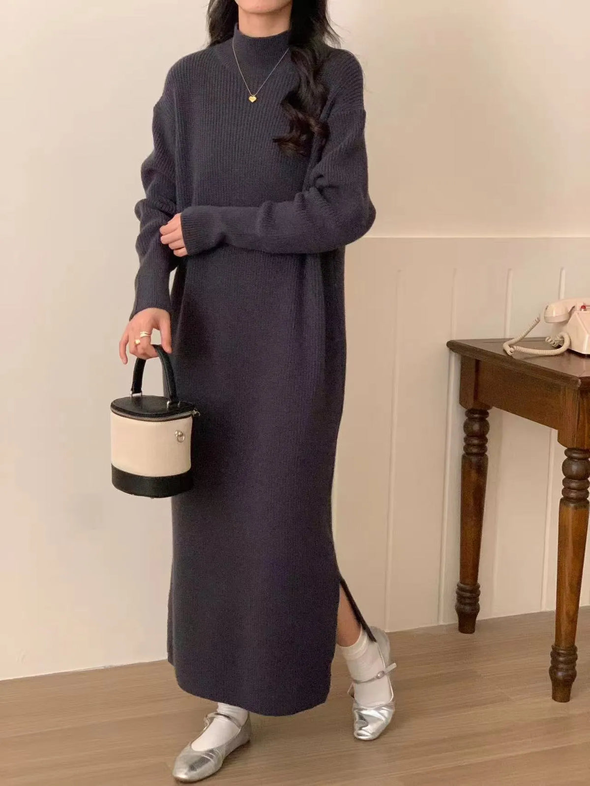 Acrylic half turtleneck knitted dress in graphite colour with high waist and overknee long length