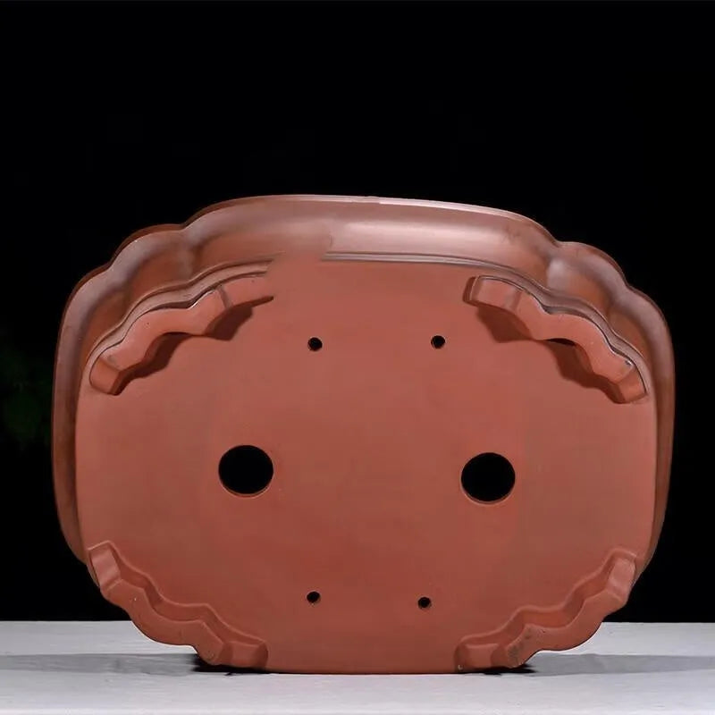 Large antique-look purple clay flowerpot with Chinese tree stump and floral patterns.