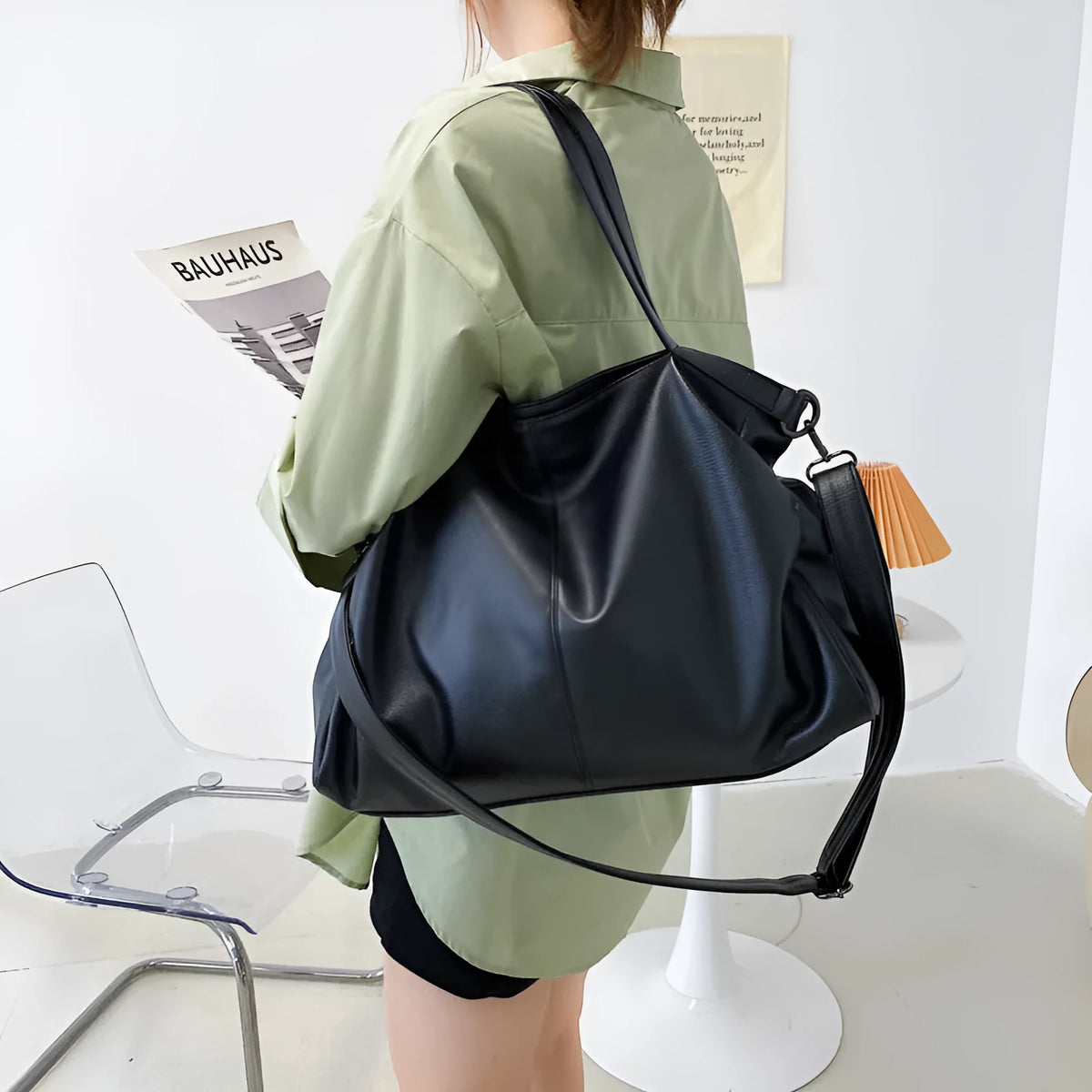 Large soft-surface PU leather messenger tote bag with long crossbody strap, shown in black colour
