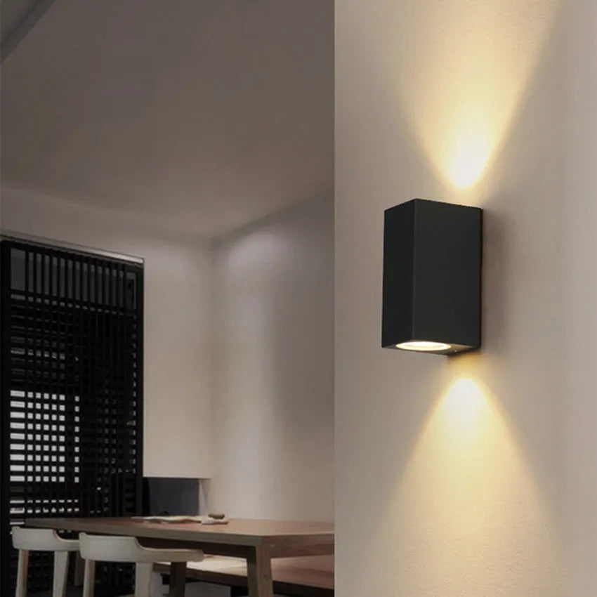 Black aluminium wall lamp with silicone rubber trim and glass elements