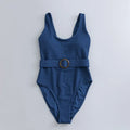 Navy blue women's one-piece swimsuit with triangle design and chest pads
