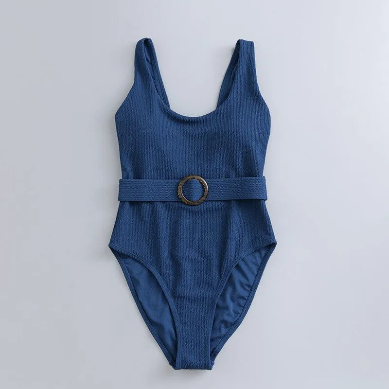 Navy blue women's one-piece swimsuit with triangle design and chest pads