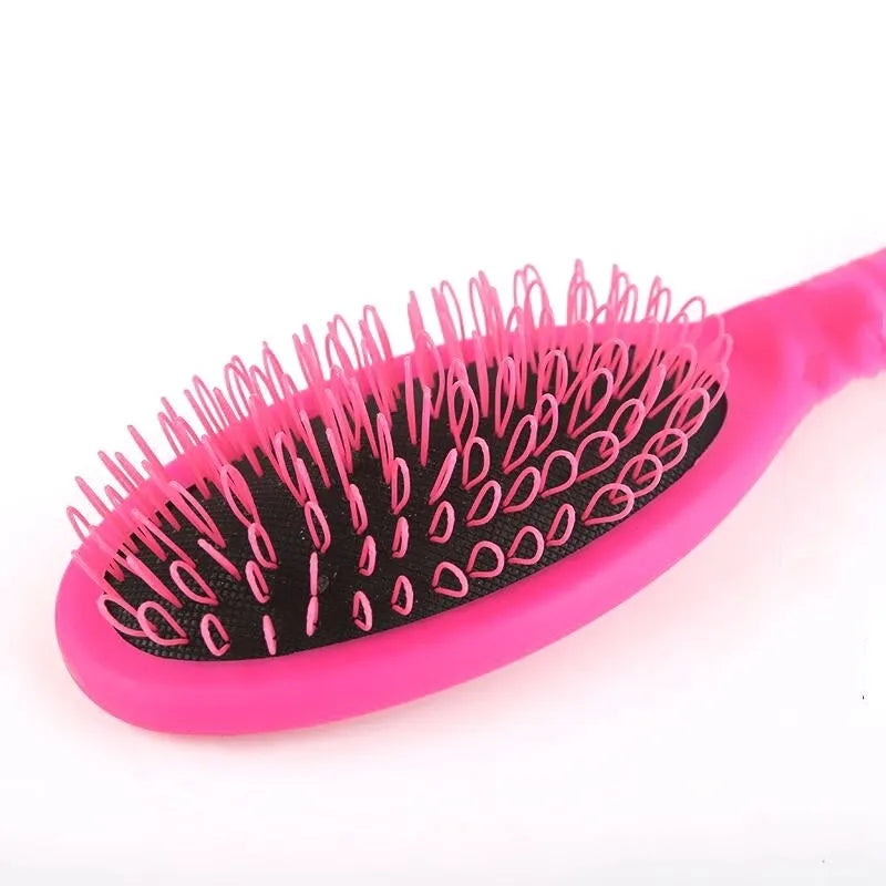 Black plastic ring tooth hair extension comb measuring 22cm by 6cm for hairdressing use