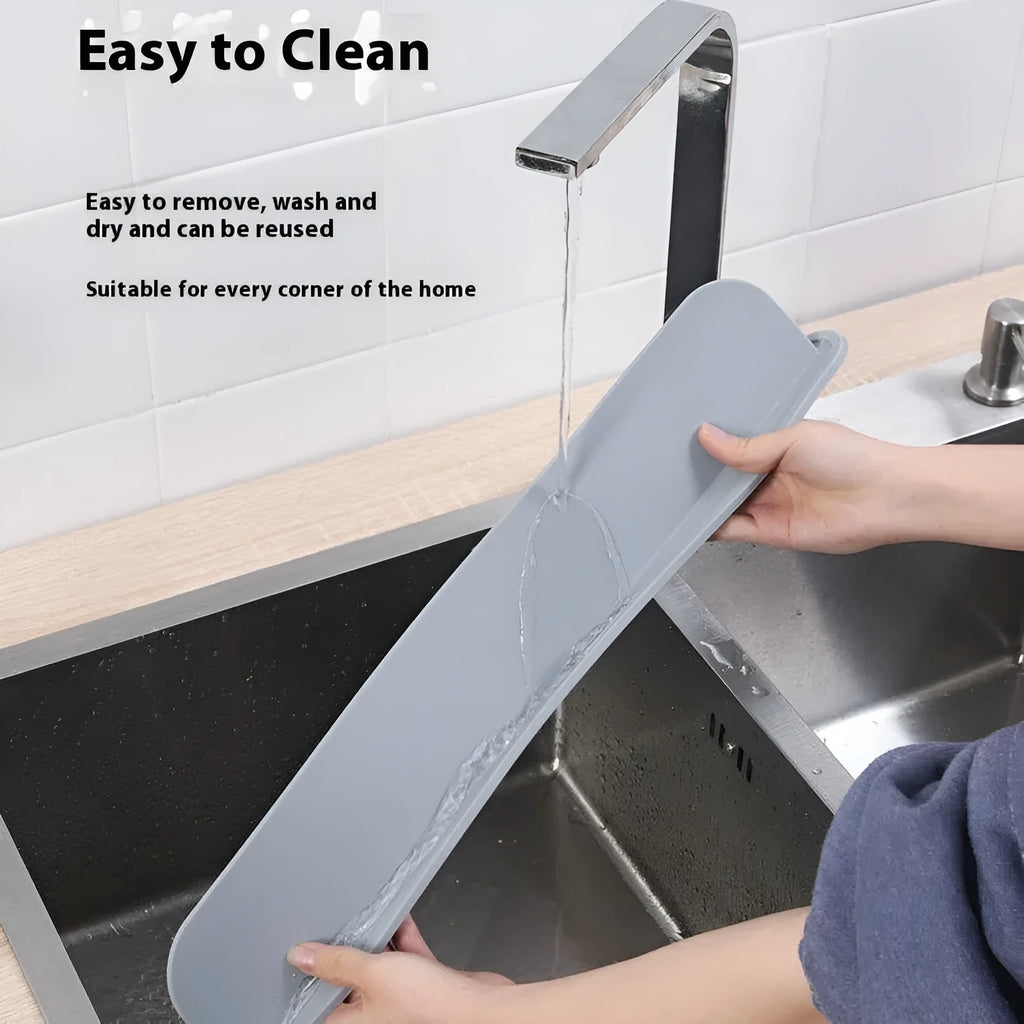 Grey silicone sink splash guard measuring 85 cm long, placed on a kitchen worktop.