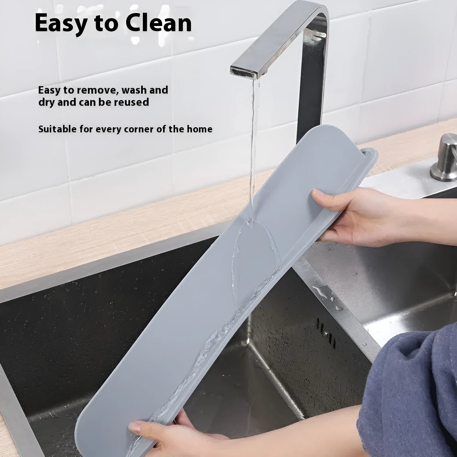 Grey silicone sink splash guard measuring 85 cm long, placed on a kitchen worktop.