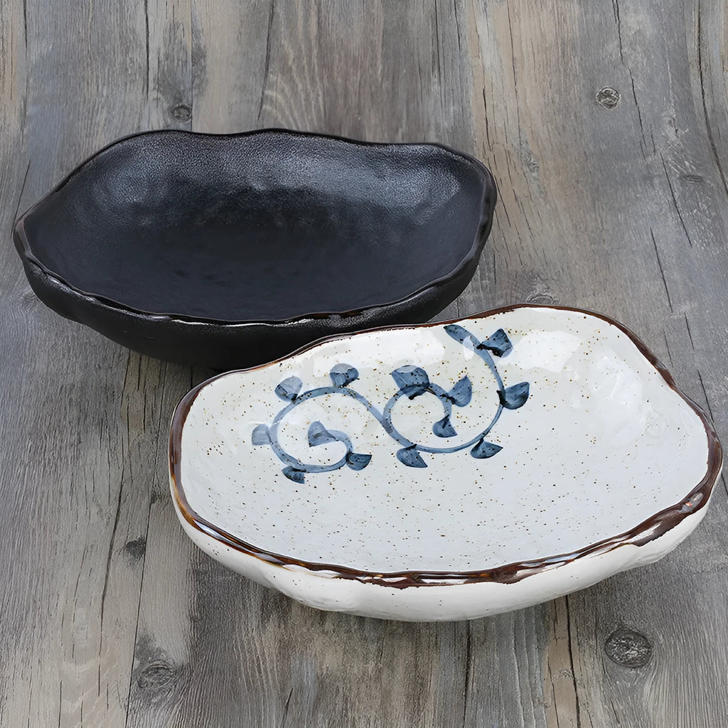 Japanese style irregular shaped ceramic sashimi bowl with floral decoration on porcelain