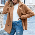A women's loose lapel fluffy winter coat with buttons, shown in a selected colour.