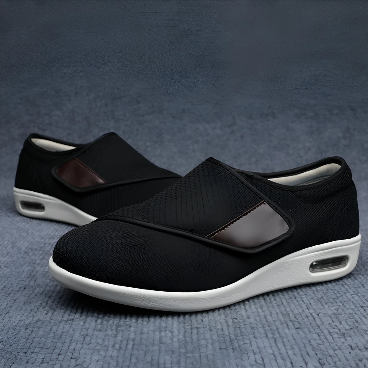 Beige and grey leisure shoes with a wide fit and a black velcro strap closure.