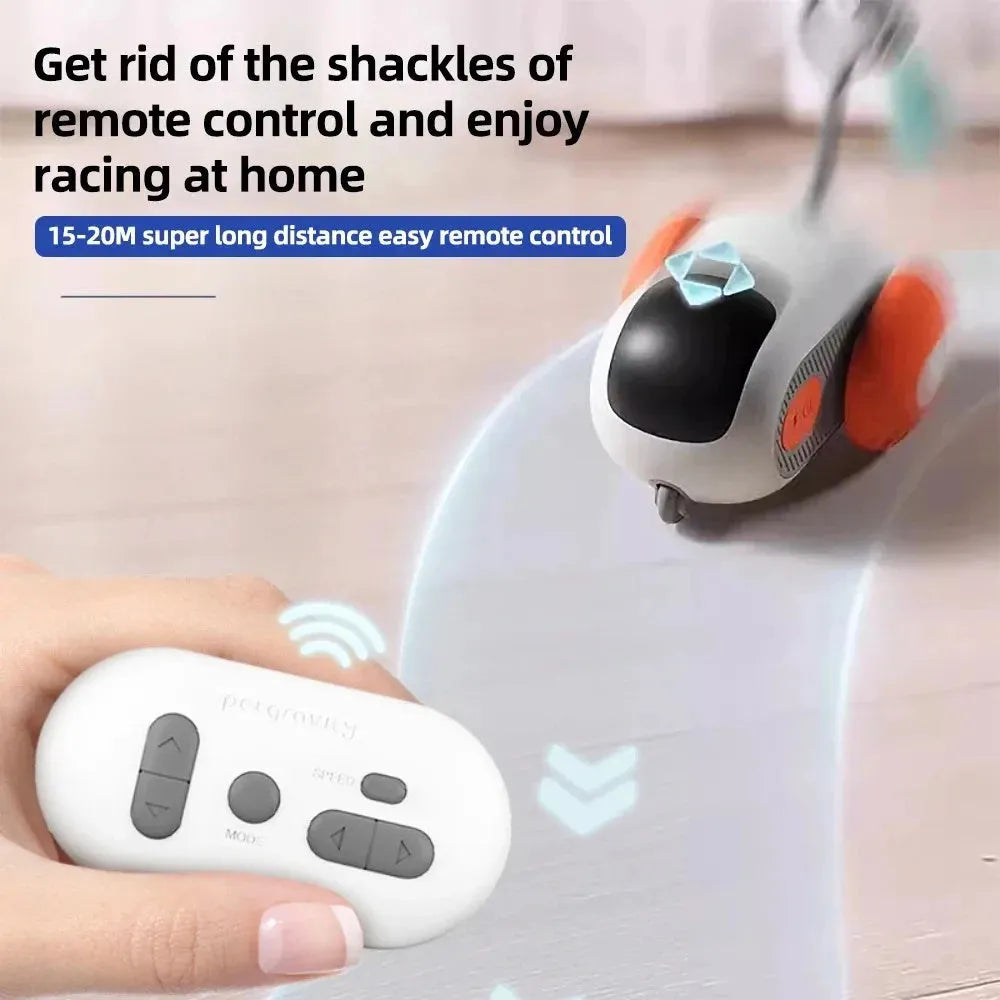 Blue smart cat toy car with feather teaser attachment and remote control unit on floor