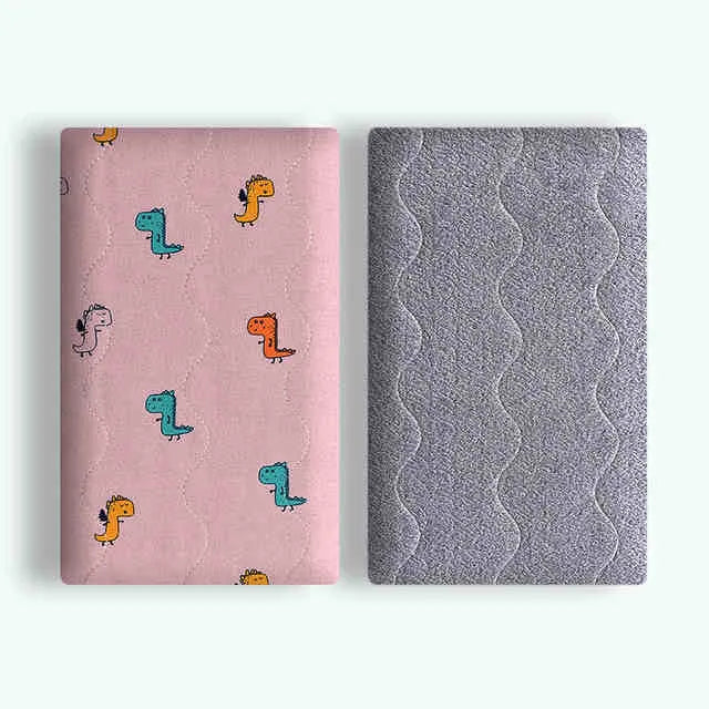 Double-sided cotton wool pet blanket with cartoon dinosaur print, shown in size L next to a dog bed.