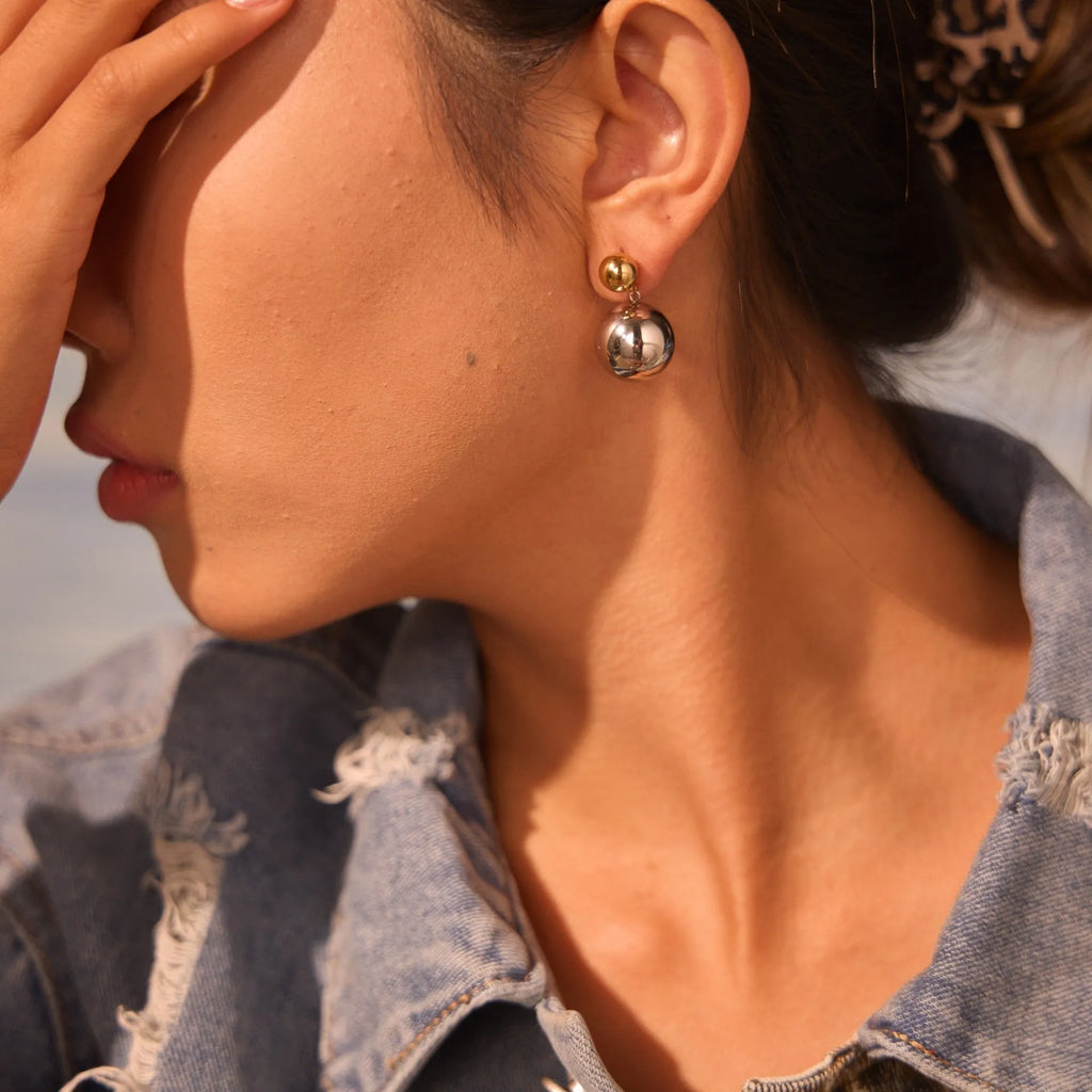 Stainless steel geometric round bead ear studs with gold electroplating and colour-block detailing