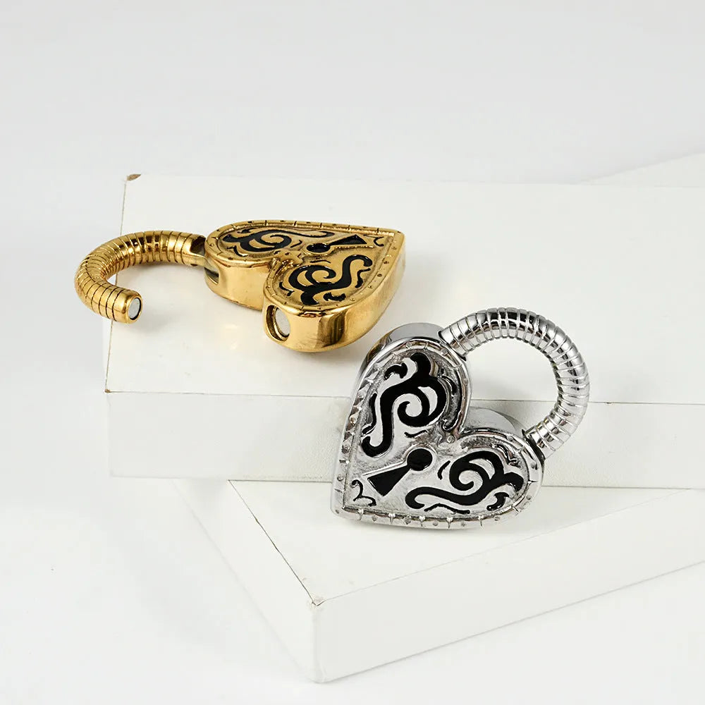Women's heart-shaped stainless steel earrings in gold or steel colour options for ear piercings