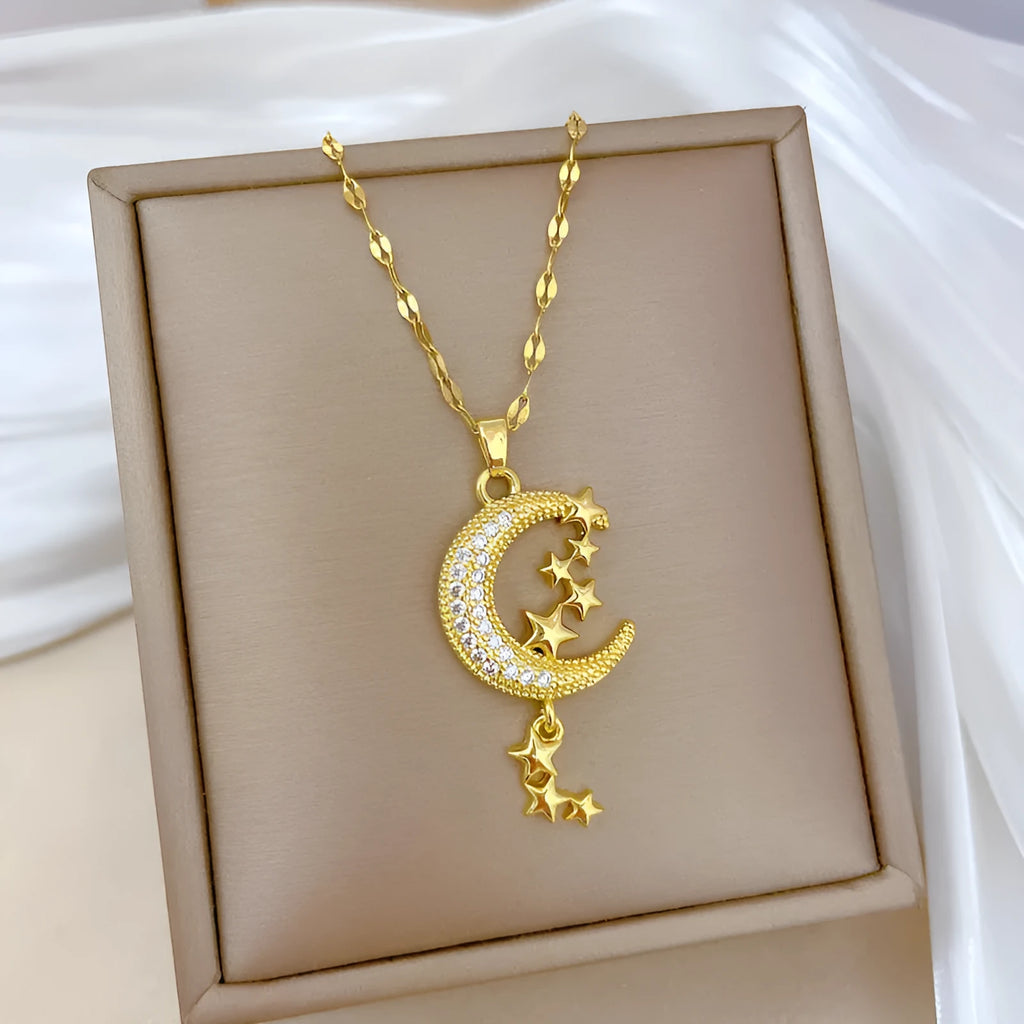 Geometric moon pendant necklace with diamond accents on stainless steel chain, copper pendant with tassel styling