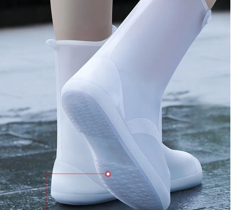 White high-top PVC reusable waterproof shoe cover shown on a foot, with size chart for S to 3XL.