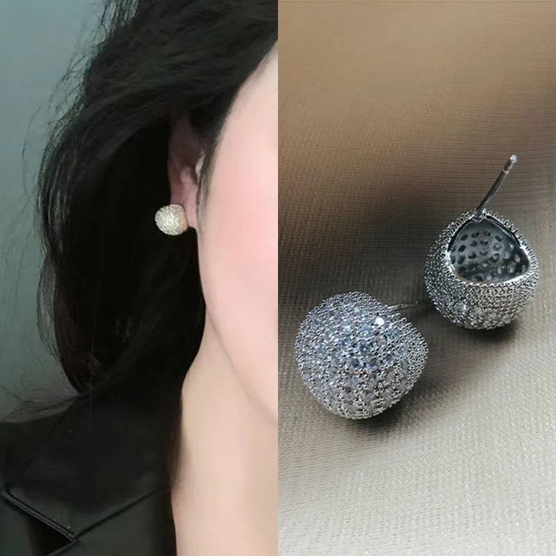 Geometric drop earrings with diamond-encrusted golden beans in gold or white