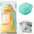 Blue silicone dog bath brush fitting over fingers for pet washing and massage