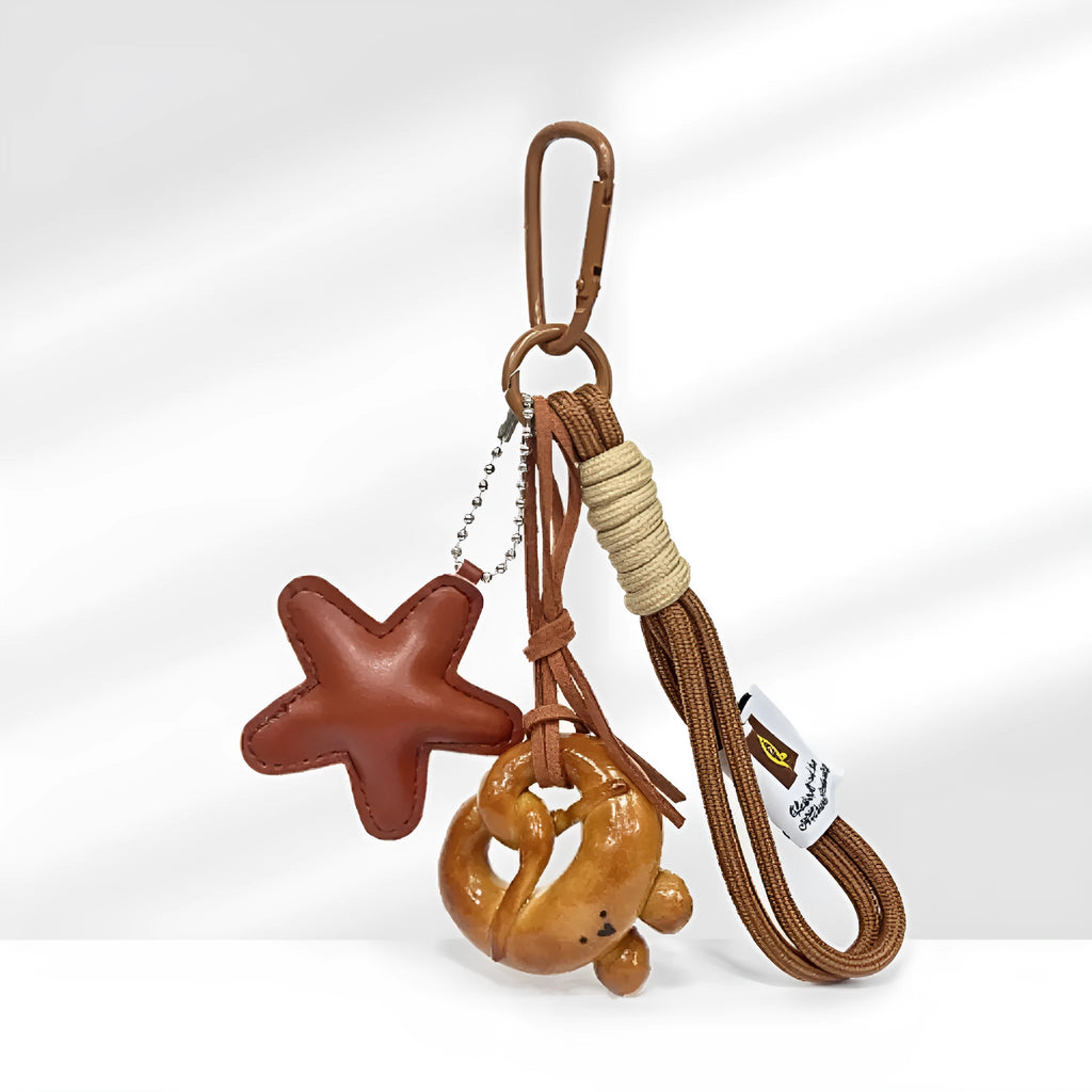 Handmade soda bread handbag pendant with bakery designs on brown strap