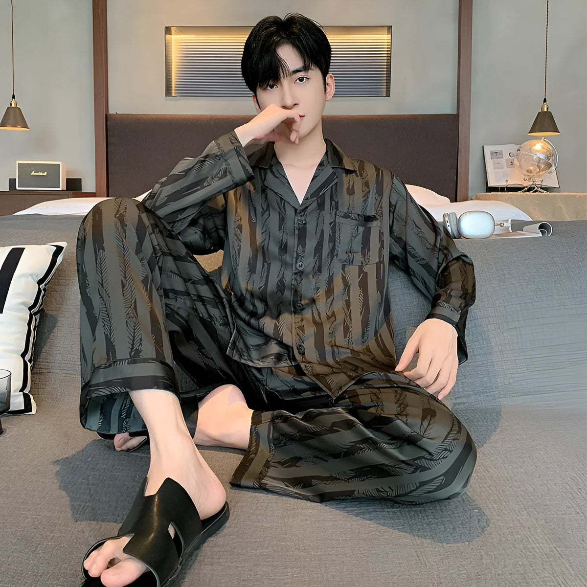 Men's black stripes ice silk pajama set showing V-neck long sleeve top and thin trousers for summer wear