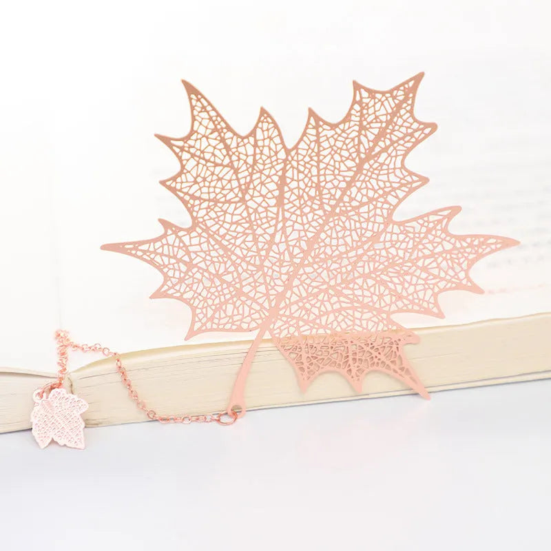 Brass metal hollow plated bookmark with leaf design and rose gold tassel