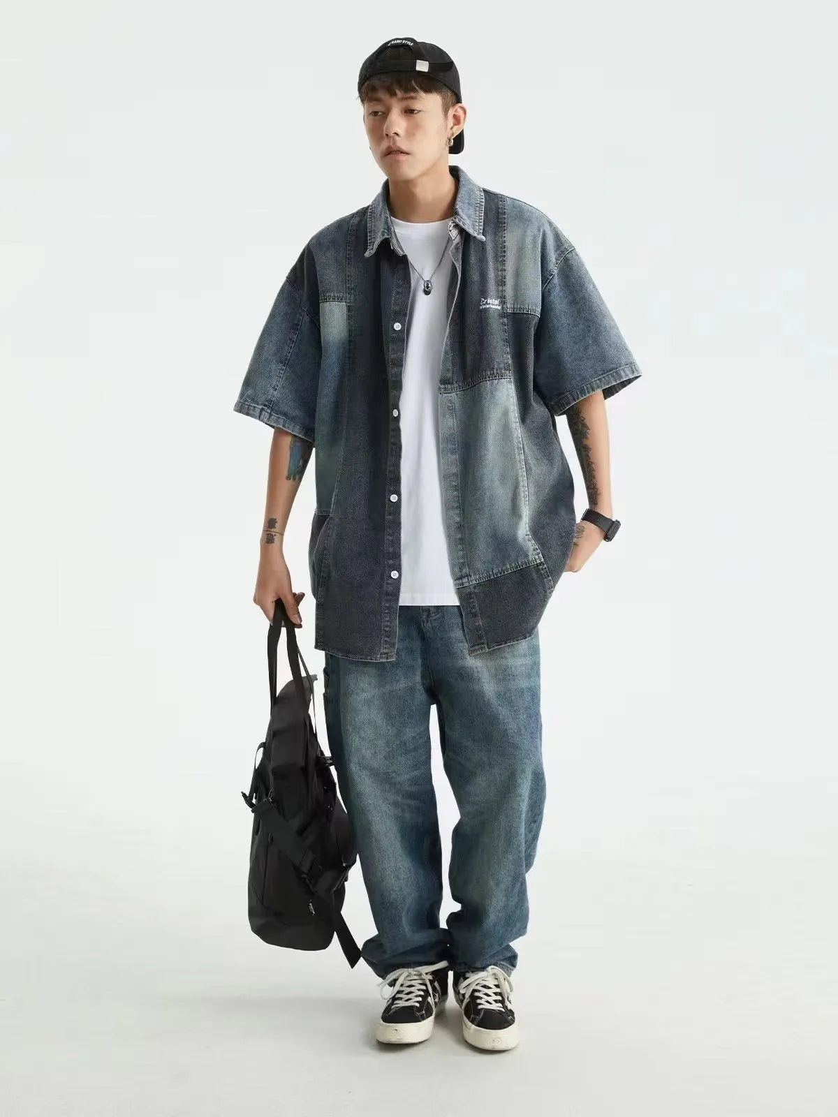 Blue loose-fit men's denim shirt cardigan with retro washed stitching on a hanger.