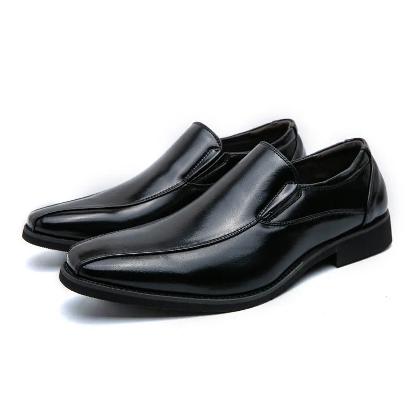 Men's black patent leather pointed toe casual shoes with a flat heel and totem design on a white background.