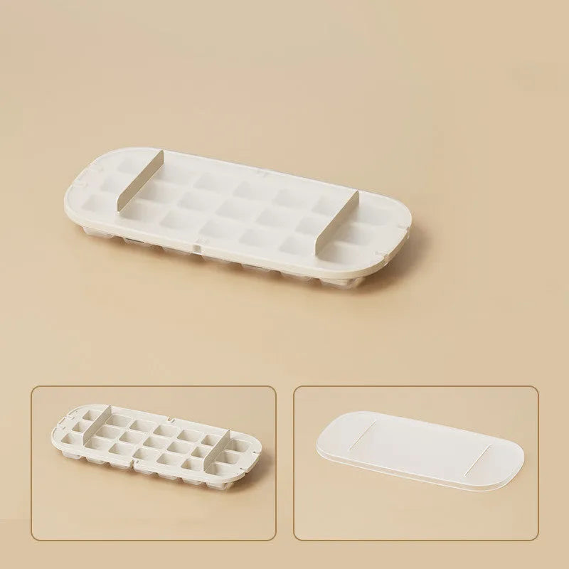 Colourful lever-action ice cube tray grid with integrated storage for its ice shovel.