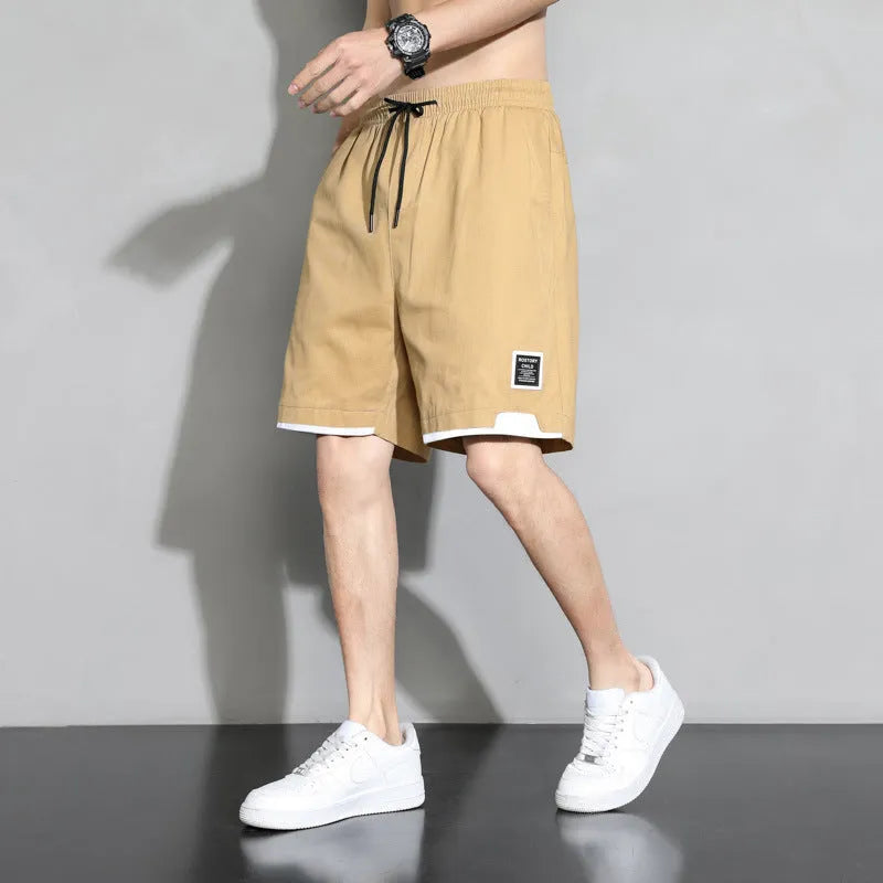 Boys cotton shorts in black, khaki and white colours showing mid waist design and shorts length