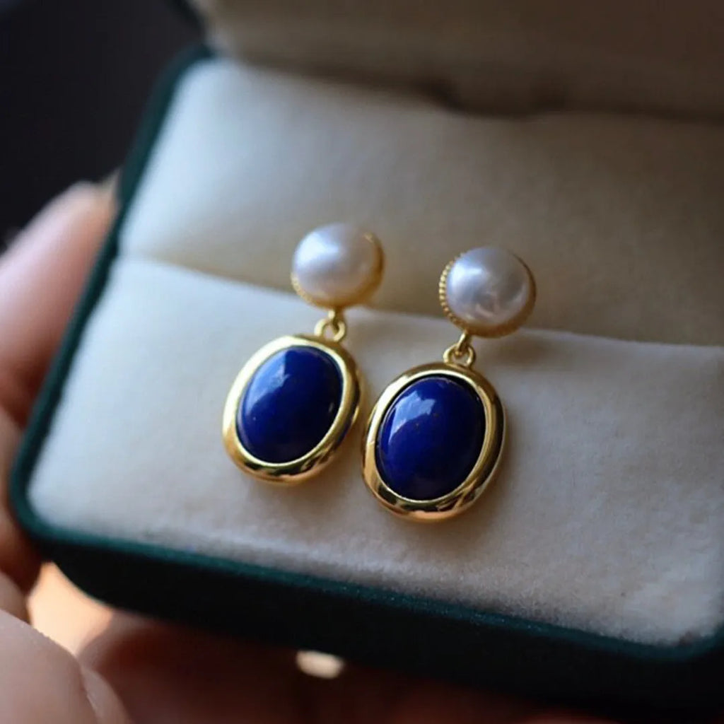 Simple drop earrings with a blue Lapis Lazuli pearl set in sterling silver, featuring auspicious pattern details.