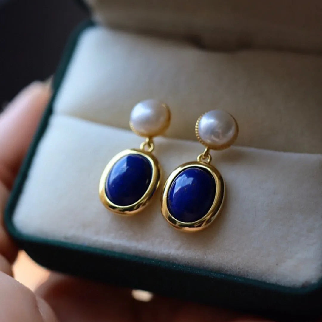 Simple drop earrings with a blue Lapis Lazuli pearl set in sterling silver, featuring auspicious pattern details.