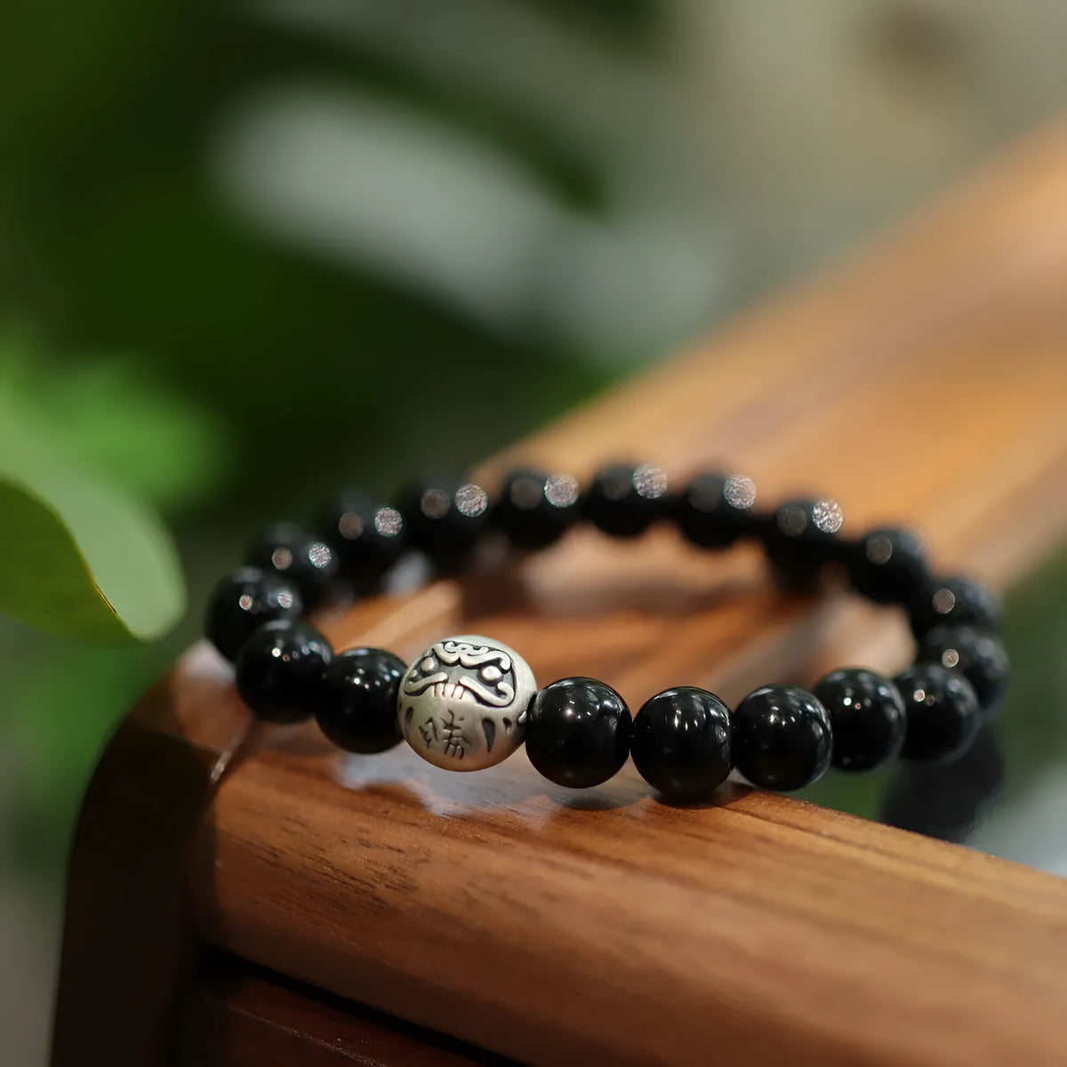 Black agate bracelet with sterling silver clasp showing Chinese style design