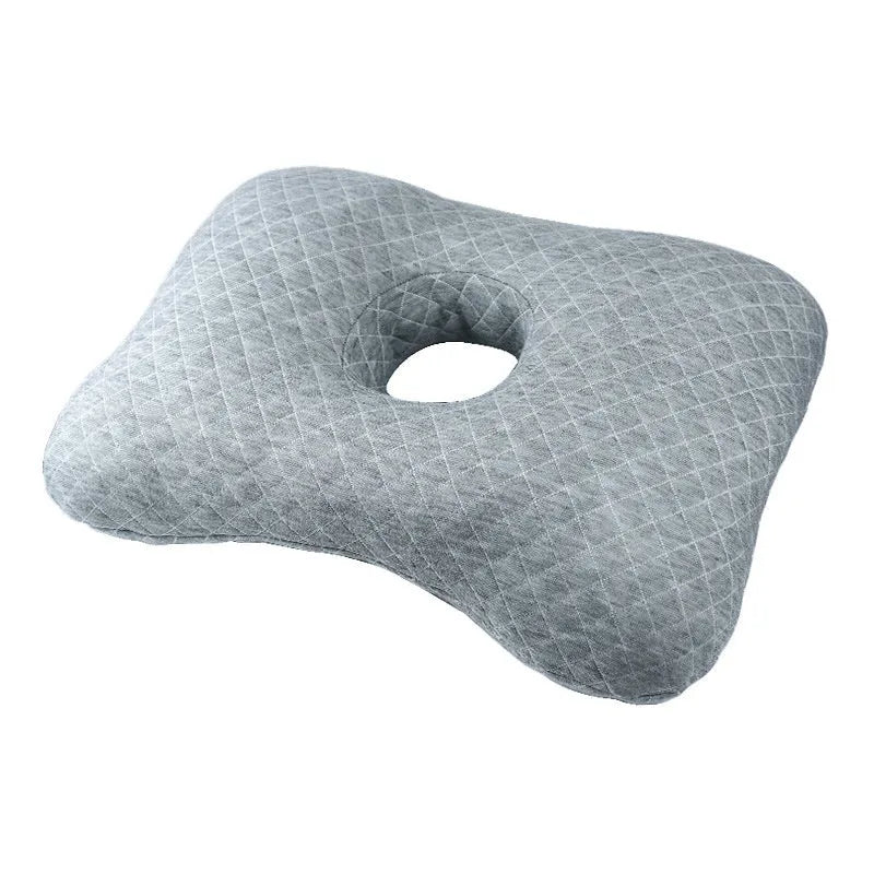Beauty salon single hole ear pillow for adults in grey colour on a treatment bed.