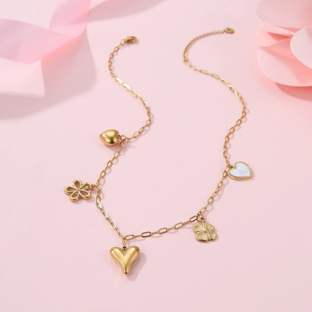 Stainless steel pendant necklace with heart or sun design on adjustable chain