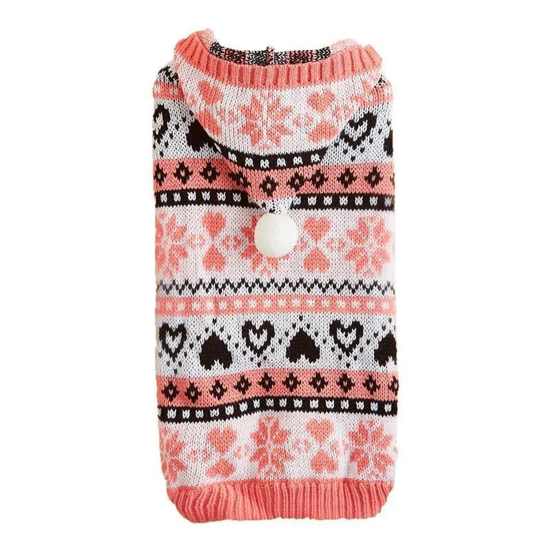 Pink knitted dog sweater with snowflake, love heart and stripe camouflage pattern on a small dog.