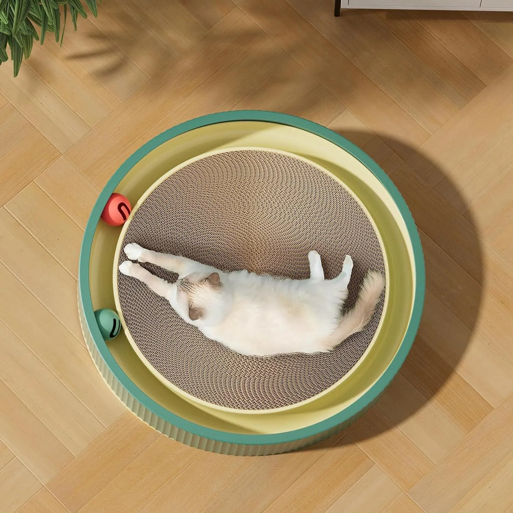 Large green circular cardboard cat scratching board with built-in track balls and a spring plush ball toy.
