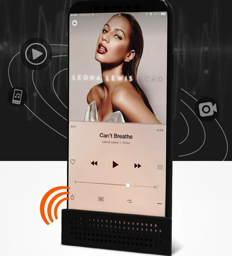 A portable black ABS mobile phone amplifier bracket holding an iPhone to boost sound for desktop use.