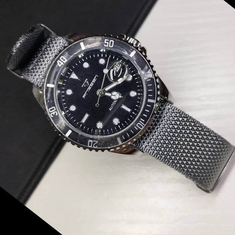 Woven nylon textile watch strap in army green colour showing integrated construction