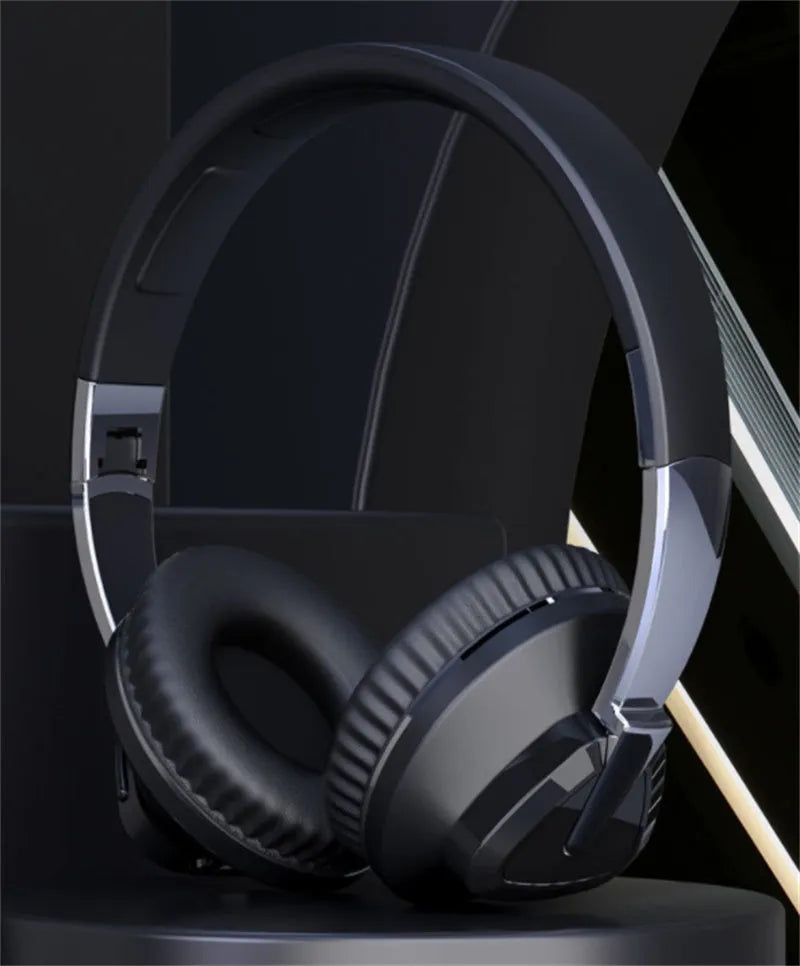 Wireless gaming headset with all-inclusive ear cushions in blue, showing AUX port and control buttons.