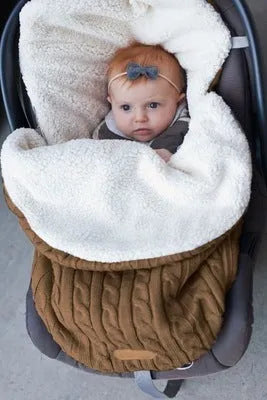 Envelope-style baby stroller sleeping bag in beige colour showing thick cotton wool filling and soft lining.